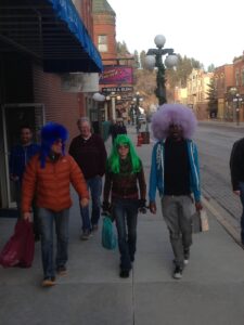 A group of people walking down the street