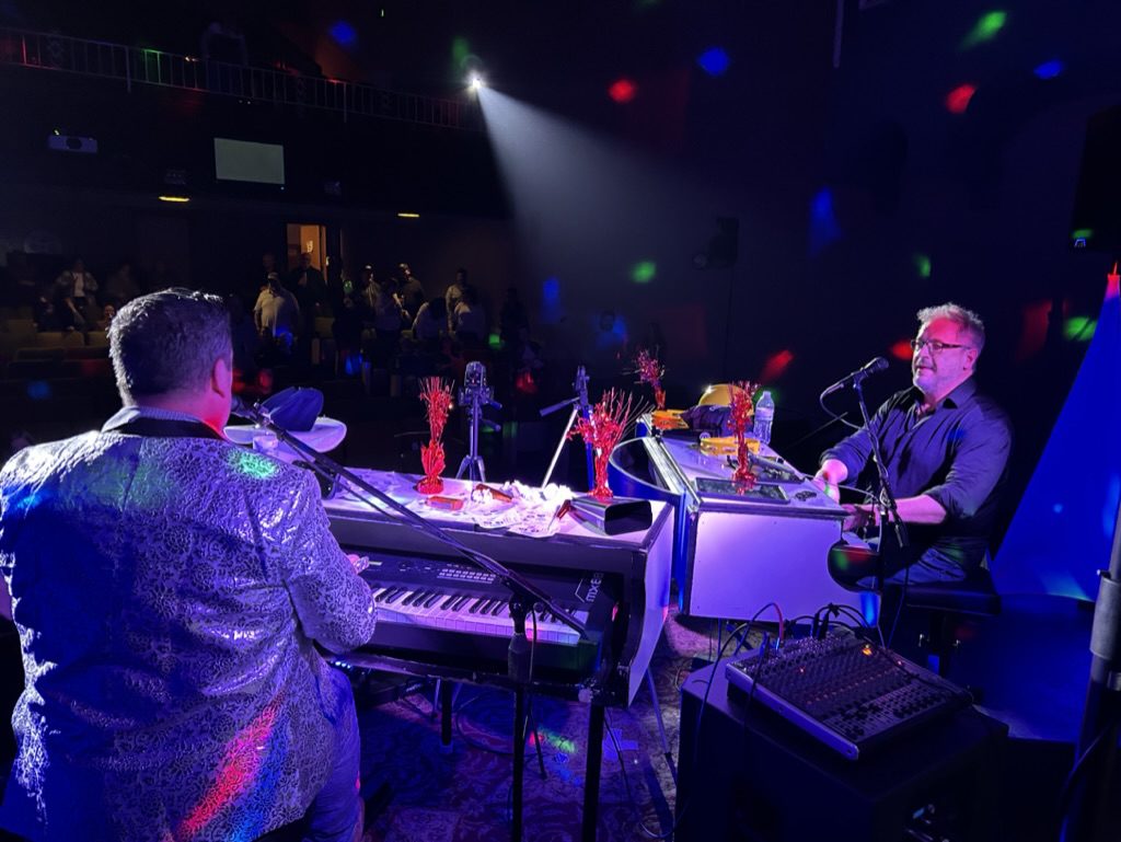 Dueling Pianos players entertaining a crowd at Kamelot Theater in Nevada, IA.